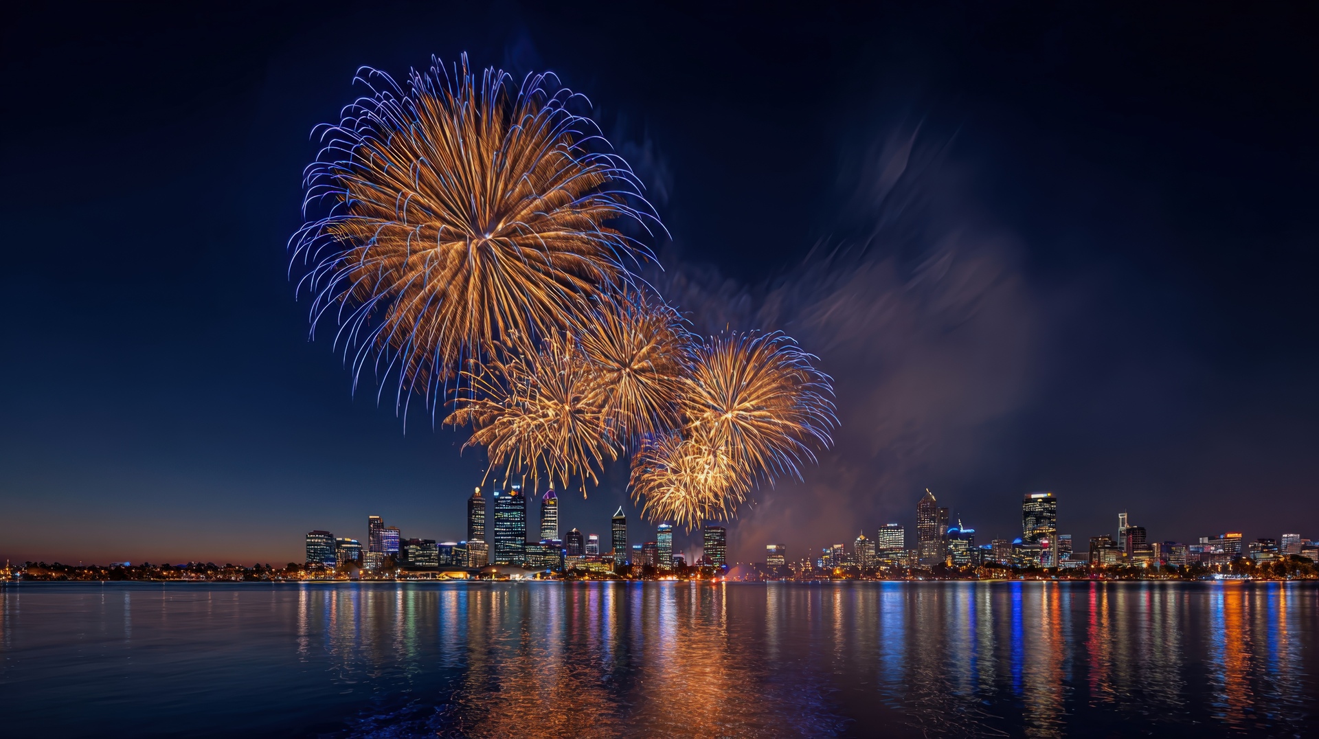 Spectacular Fireworks Display Over City Skyline At Night